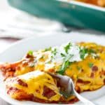 Creamy, cheesy green chili chicken enchiladas! | girlgonegourmet.com