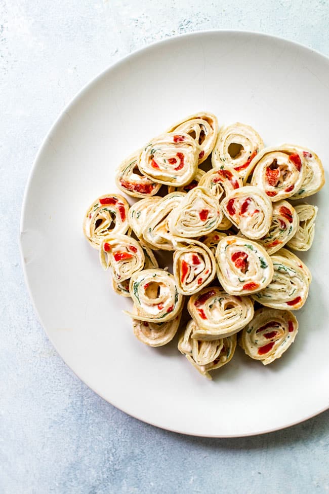 Roasted red pepper & basil pinwheels on a plate