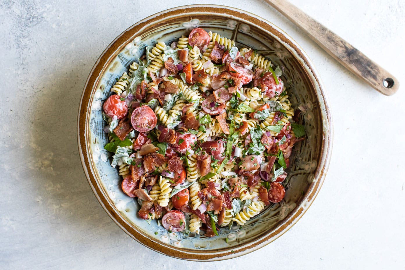 overhead photo of BLT pasta salad in a bowl