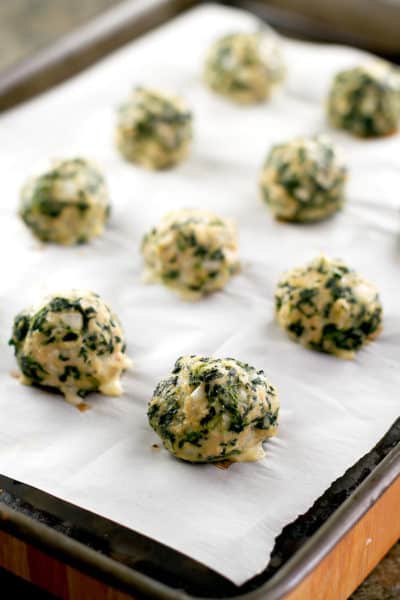 chicken and spinach meatballs on a baking sheet