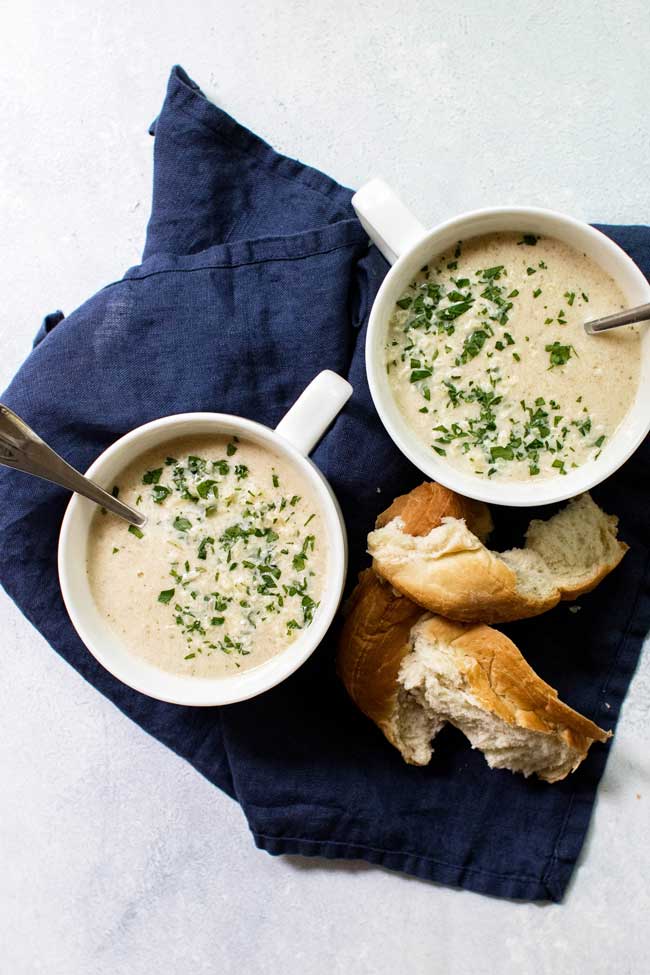 Two bowls of roasted cauliflower and kohlrabi soup