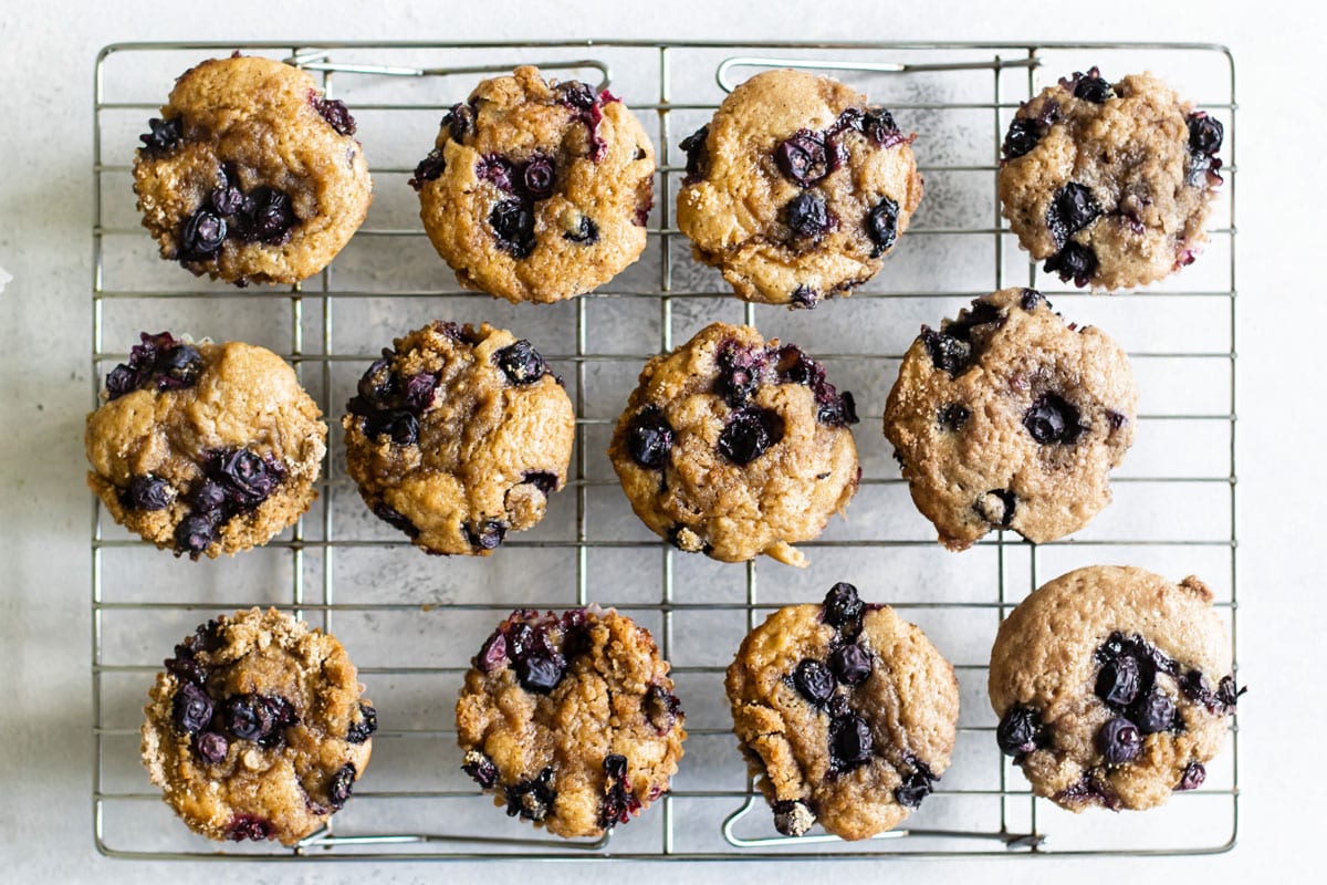 overhead photo of blueberry buttermilk muffins on a baking rack