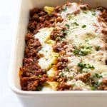 Four Cheese Manicotti with Meat Sauce in a baking dish