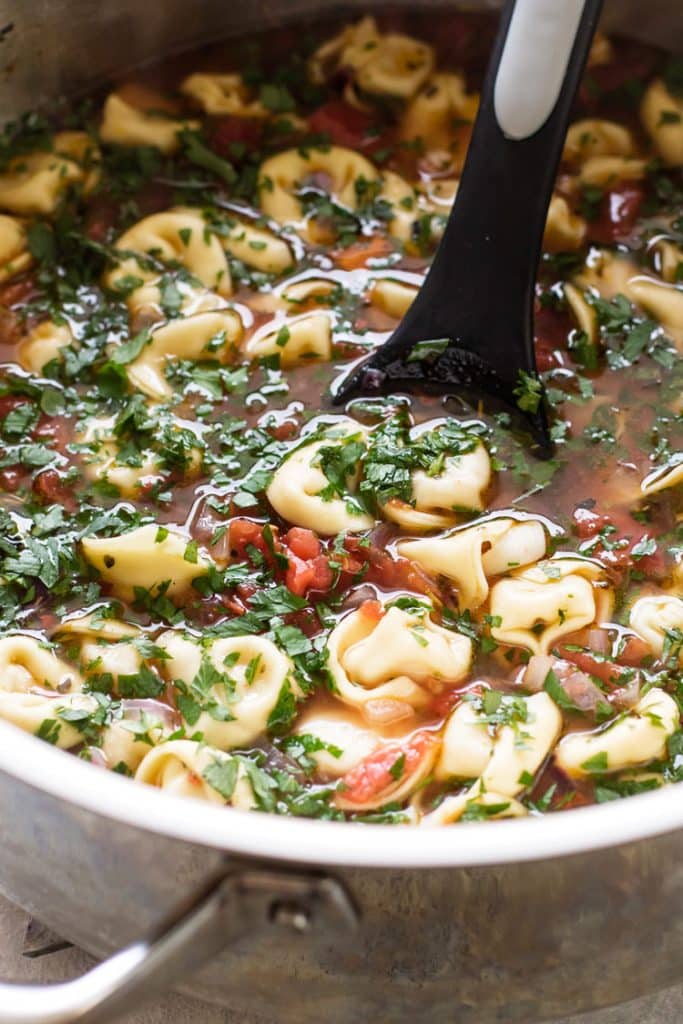 close-up photo of a pot of tortellini soup