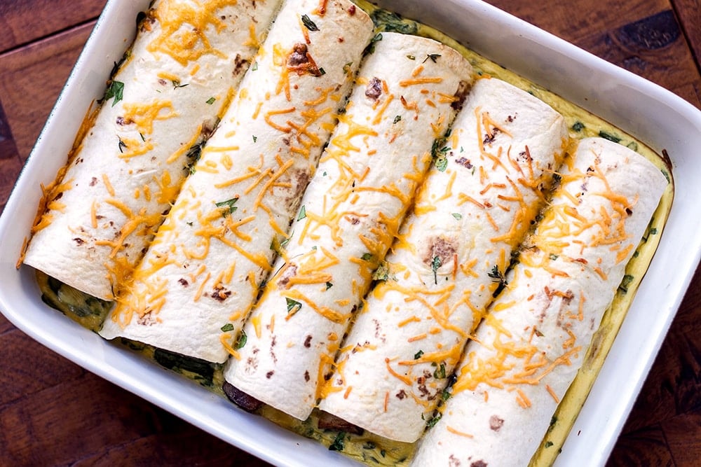 Potato pancetta breakfast enchiladas in a baking dish