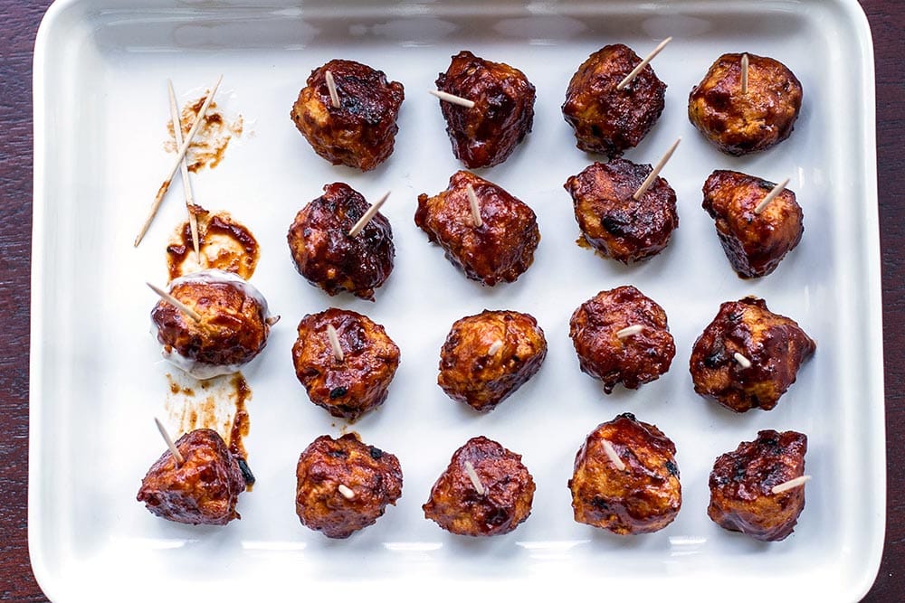 Honey BBQ chicken meatballs on a white platter