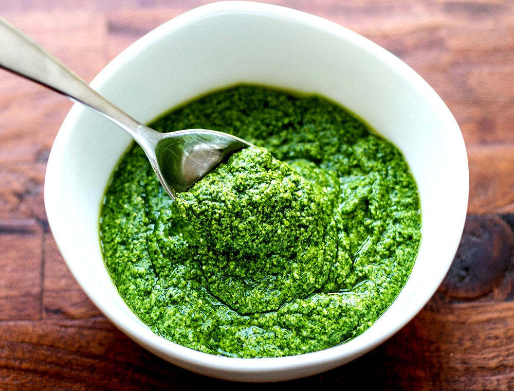 Spinach & Parsley Pesto in a bowl with a spoon
