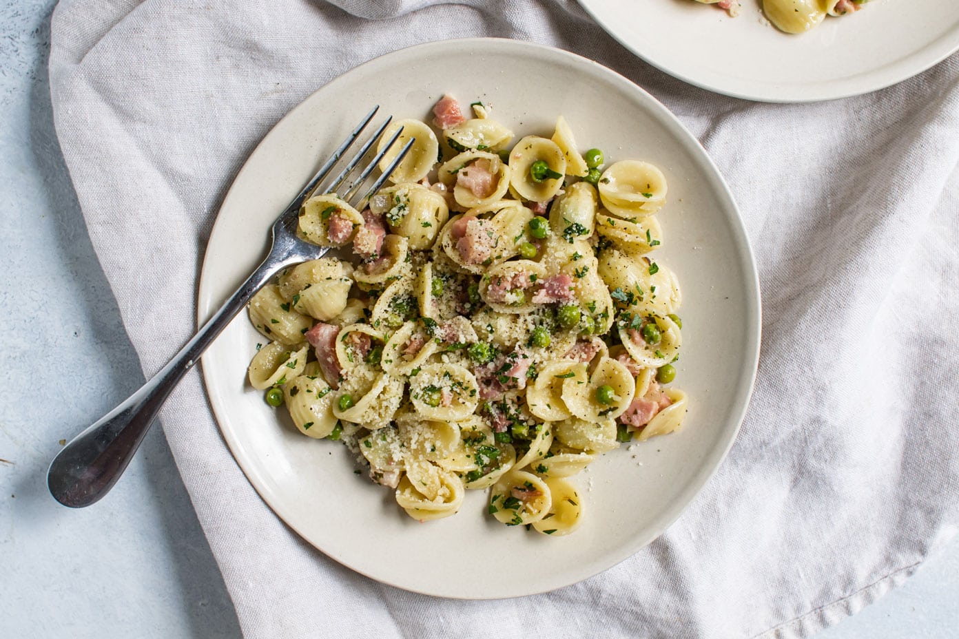 overhead photo of pancetta pasta with peas