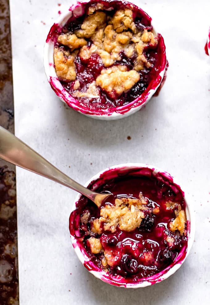 two berry crumbles on a sheet pan