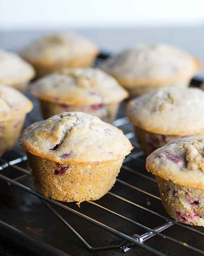 baked raspberry muffins on a baking rack