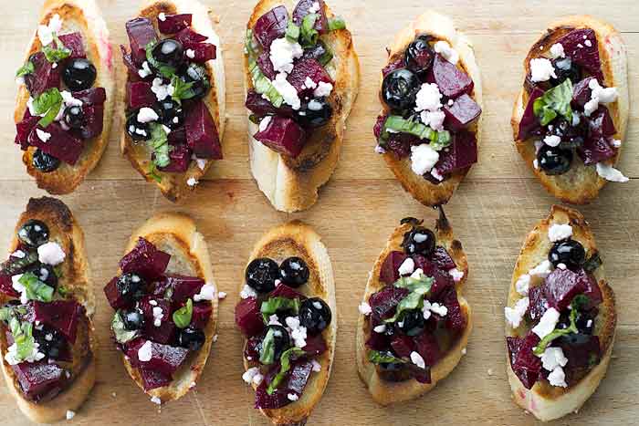 Beet & Blueberry Bruschetta on a cutting board