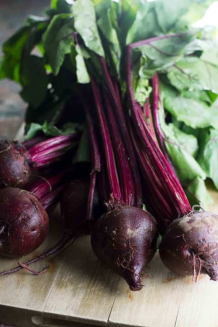 fresh beets on a cutting board