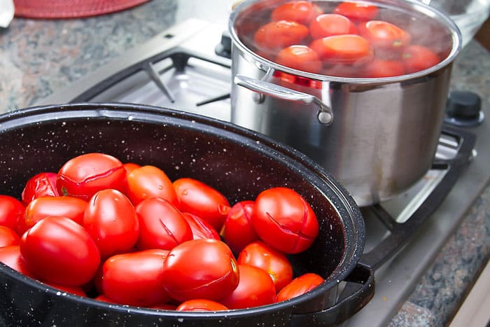 tomatoes ready to be blanched in boiling water