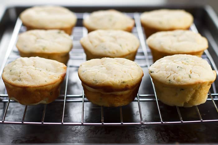 savory ricotta muffins on a baking rack
