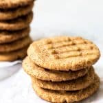 Stacked peanut butter cookies spiced with nutmeg, cloves, sugar, and cinnamon