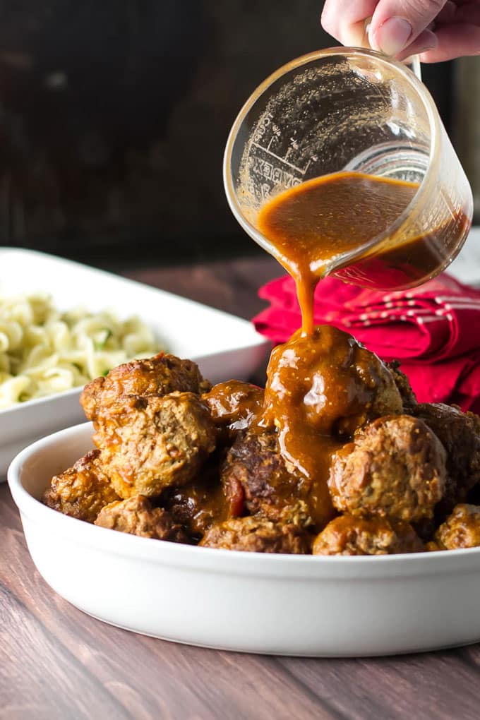 Pouring sauce over the meatballs