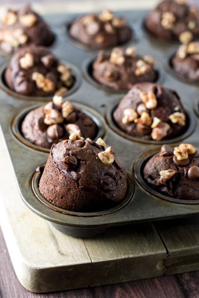 Photo of double chocolate banana muffins in a muffin pan