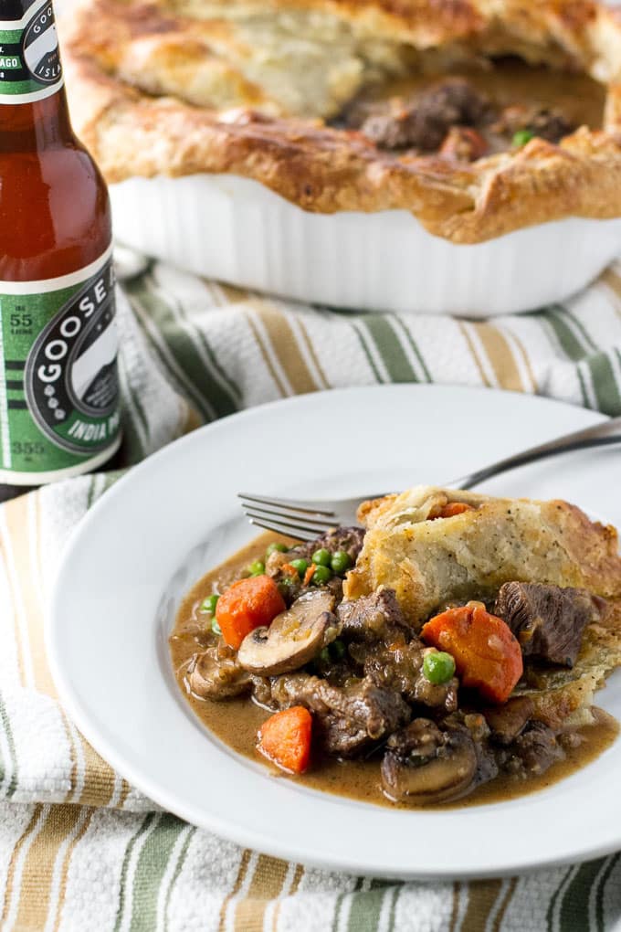 beef pot pie with a bottle of beer