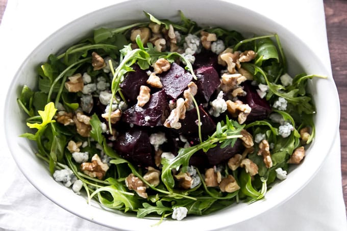 roasted beet salad in a white serving dish