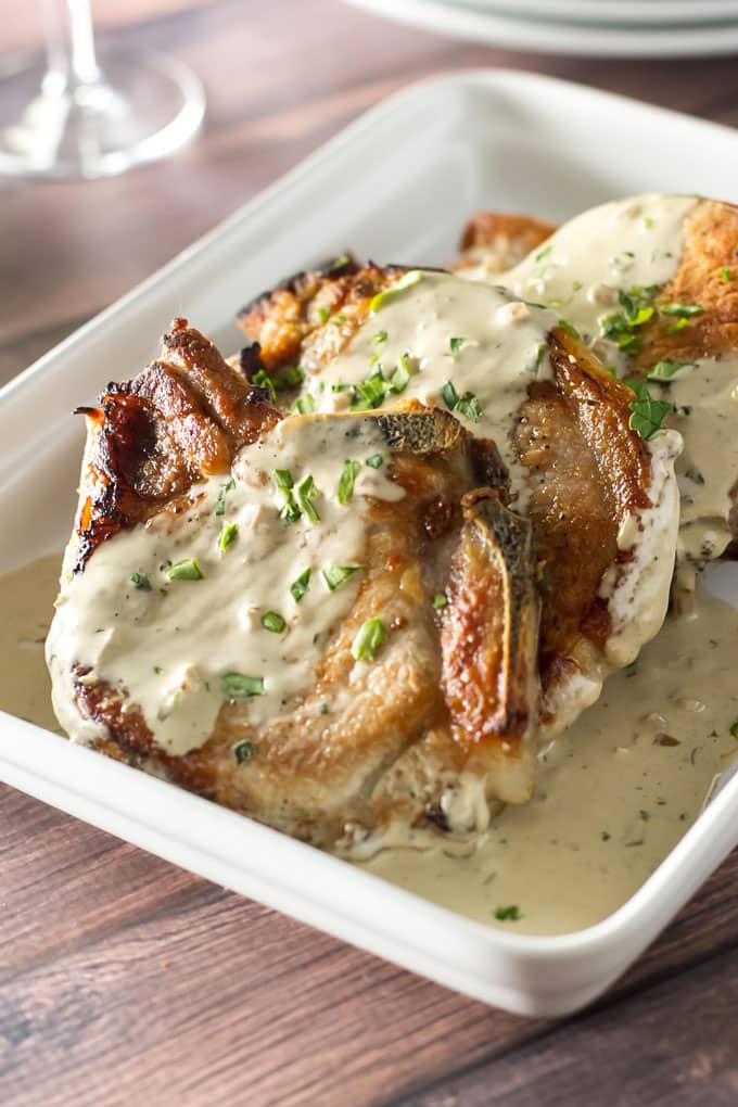 close-up photo of oven-roasted pork chops topped with mustard sauce