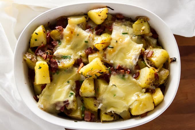 Tartiflette in a white baking dish