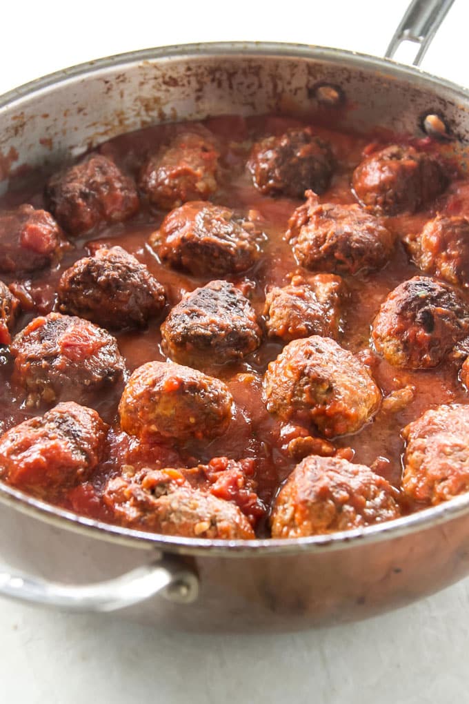 Meatballs and tomato sauce in a large skillet