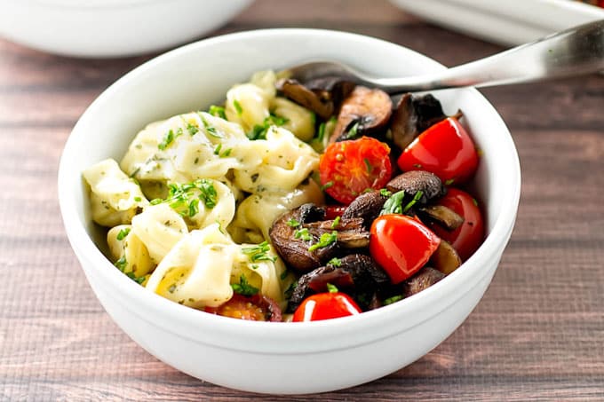 Creamy Pesto Tortellini with Roasted Mushrooms and Tomatoes | girlgonegourmet.com