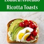Toast topped with a creamy avocado ricotta spread and loaded with grape tomatoes, avocado slices, and hard boiled eggs | girlgonegourmet.com