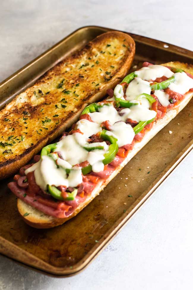 photo of loaded pizza sandwich with melted cheese