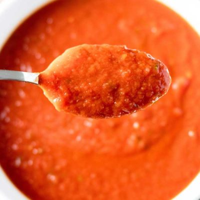 overhead photo of a spoonful of tomato sauce