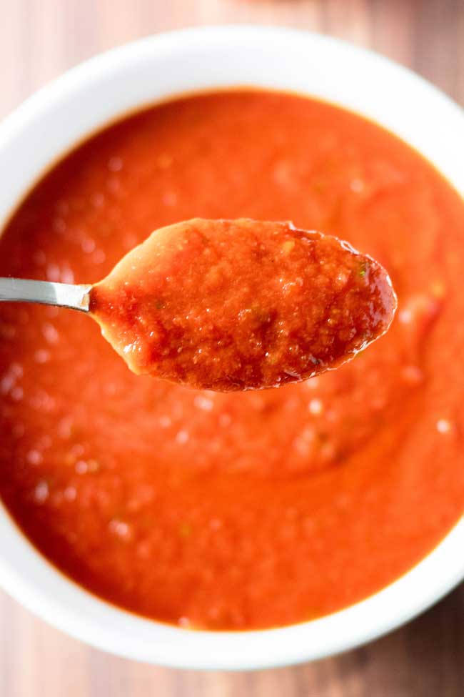 overhead photo of a spoonful of tomato sauce