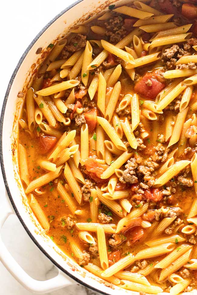 photo showing the pasta added to the beef mixture