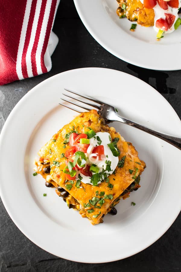overhead photo of a slice of enchilada casserole
