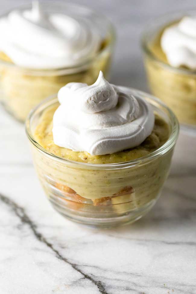a pistachio pudding parfait with a dollop of whipped cream