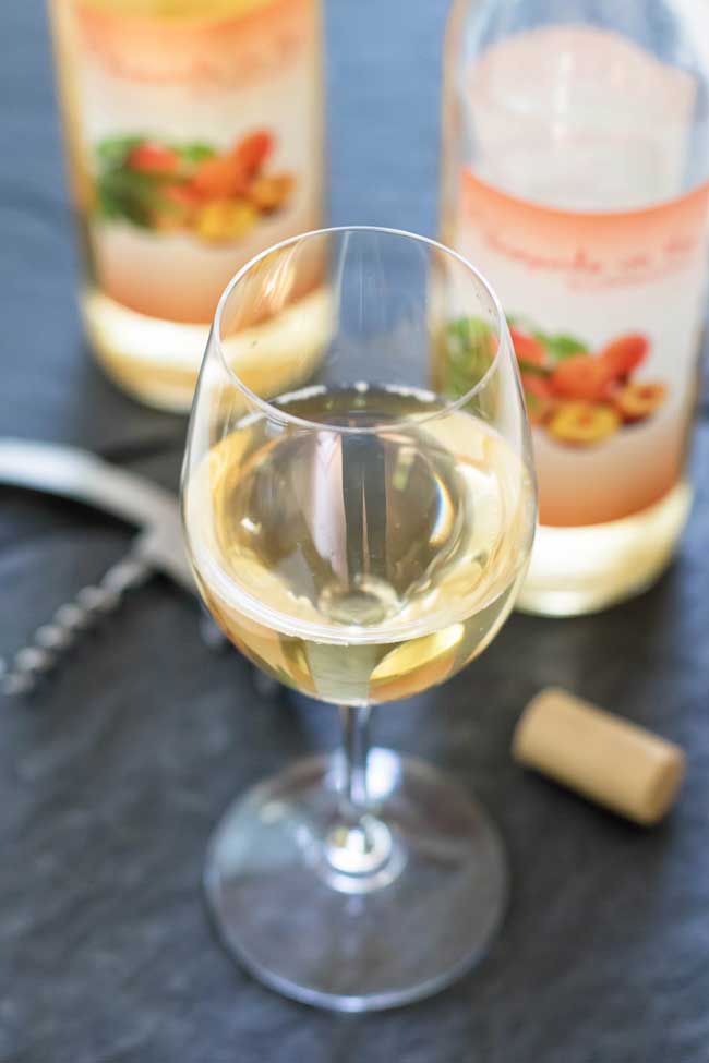 A glass of peach wine