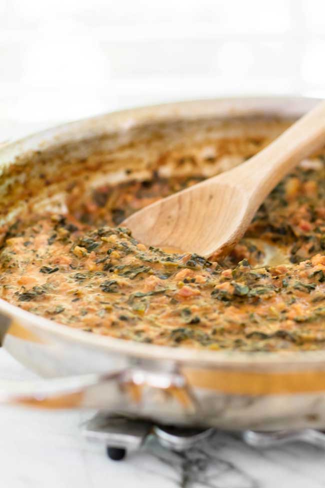 Spinach and pancetta sauce in a skillet