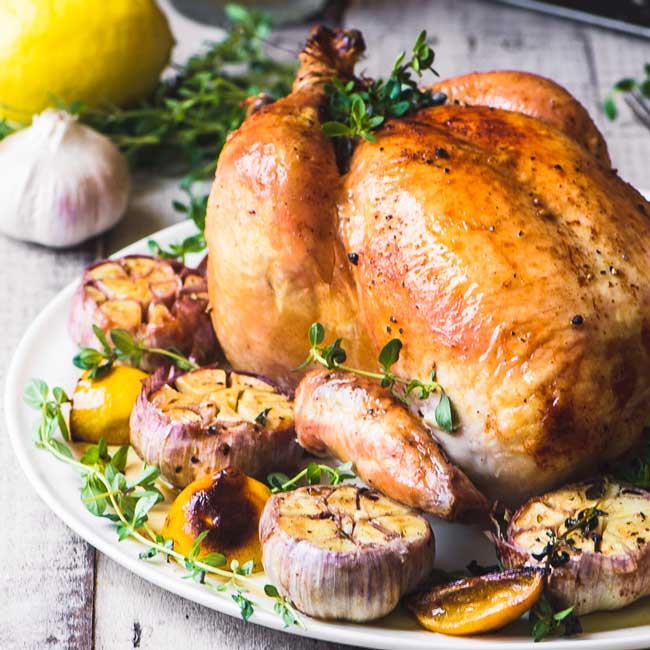 photo of a roasted chicken with garlic