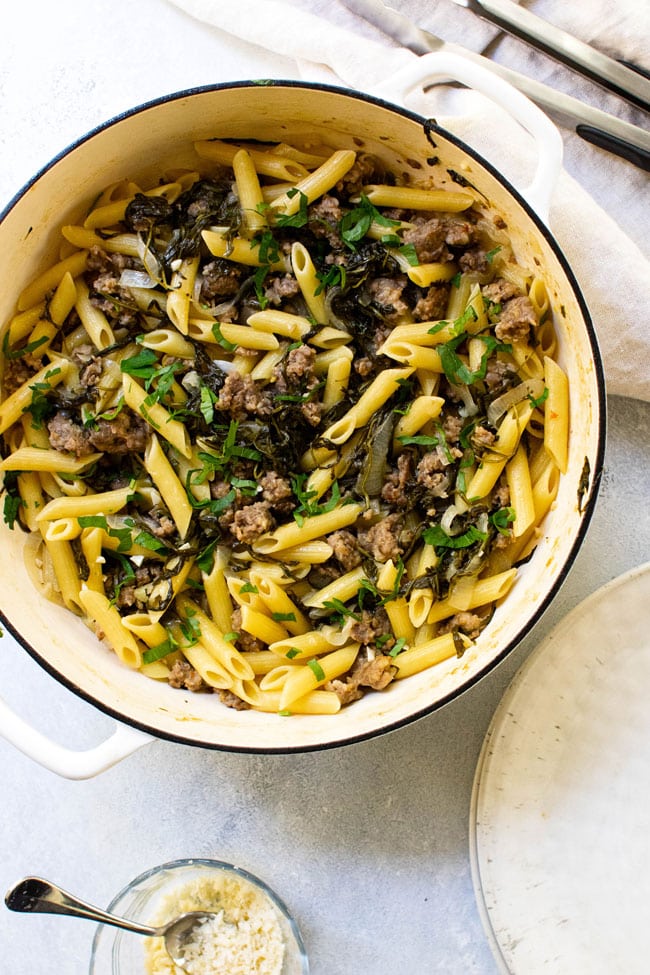 One-pot penne with sausage and arugula