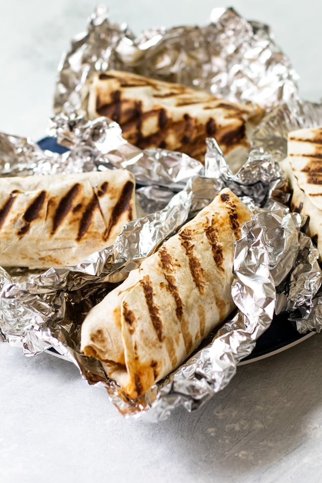 Tropical BBQ chicken wraps on tin foil