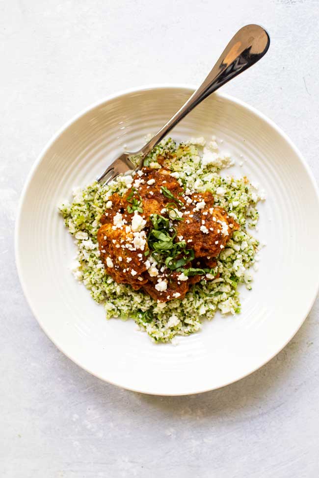 Zucchini Turkey Meatballs with roasted red pepper sauce on a white plate