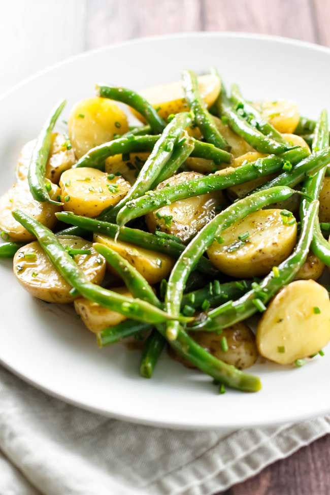 Green bean potato salad on a plate with a napkin