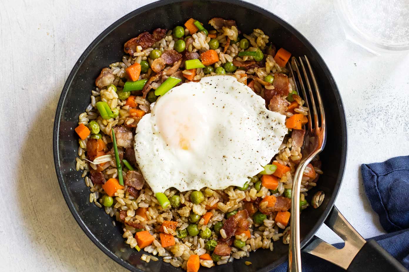 bacon fried rice in a black skillet