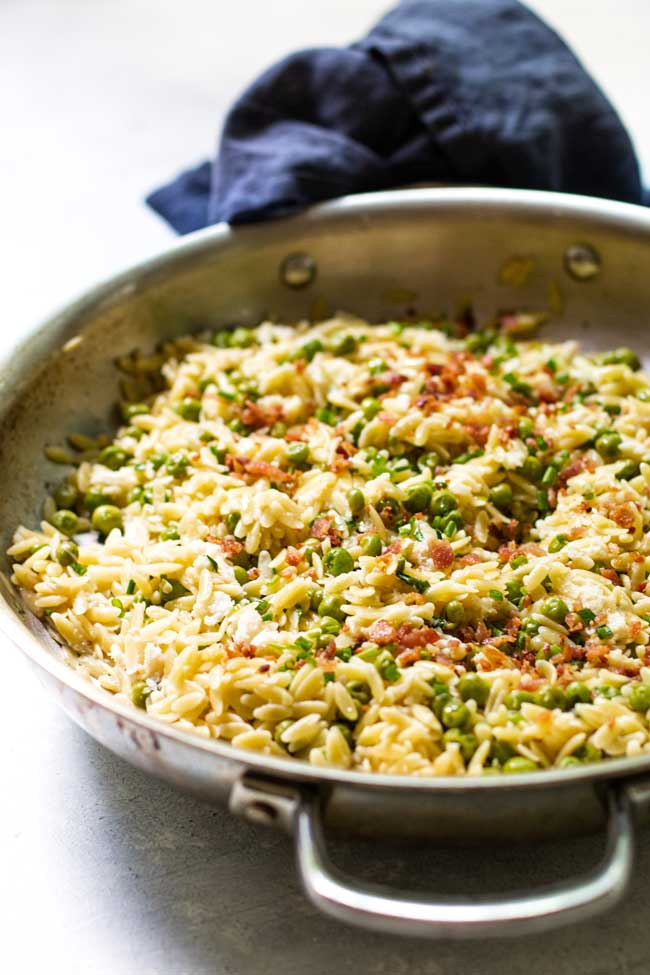 bacon orzo pasta with crab in a skillet