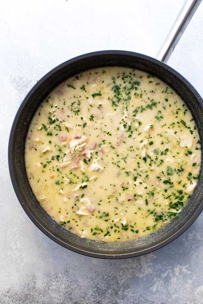 overhead photo of chicken cordon bleu soup in a large pan