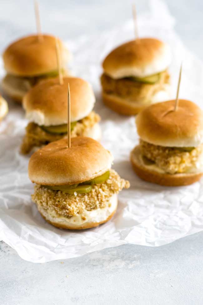 photo of crispy baked chicken sliders on parchment paper
