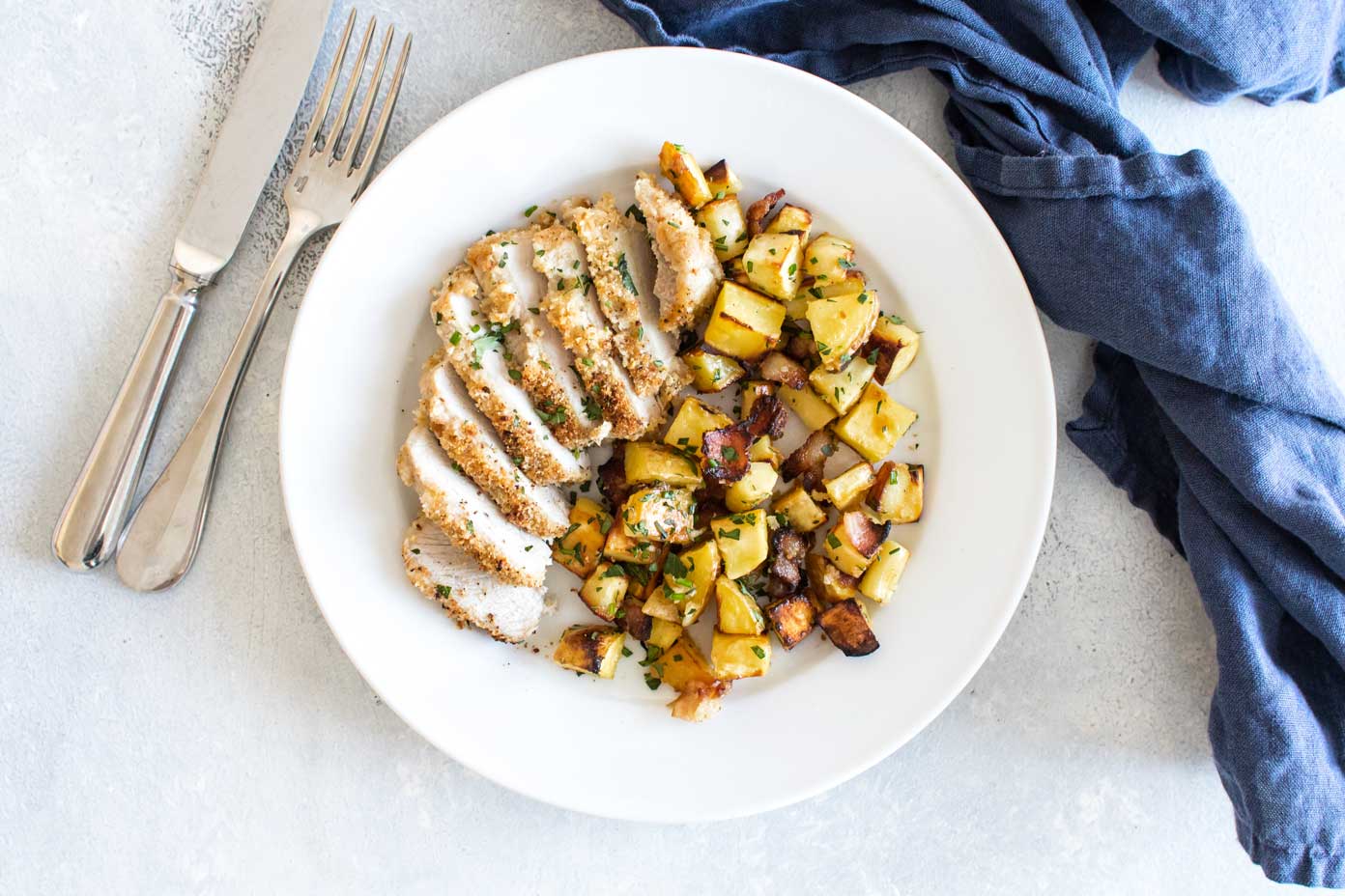 overhead photo of a plate of sliced pork and parsnips