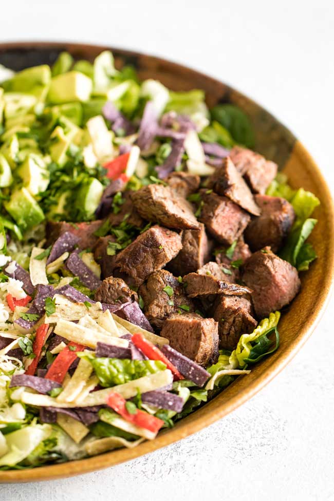 Close-up photo of a steak taco salad