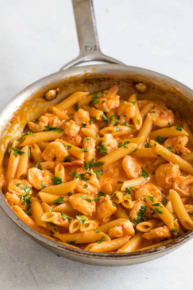 Photo of a skillet with shrimp penne with vodka sauce