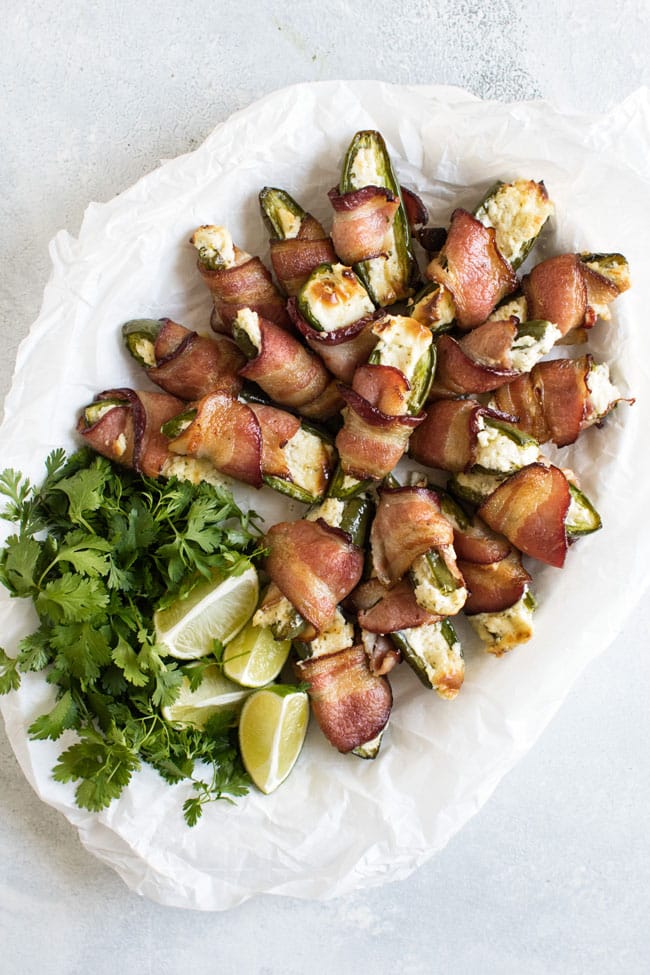 overhead photo of a plate of bacon wrapped jalapeno poppers