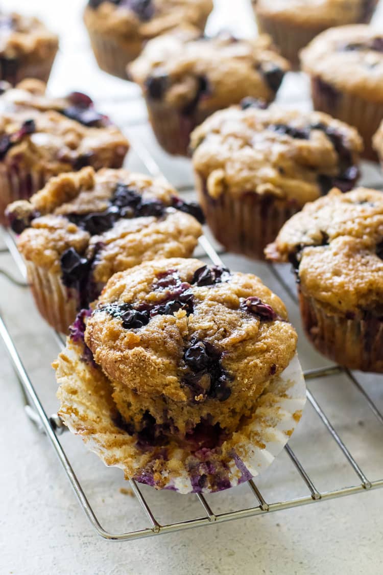 close-up photo of a blueberry buttermilk muffin on a baking rack